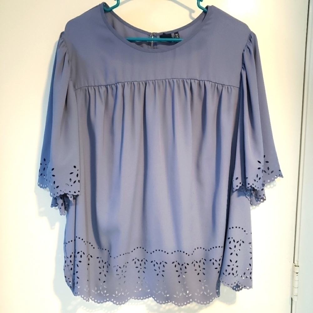 BLUE SHORT SLEEVE TOP WITH LASER CUTOUTS